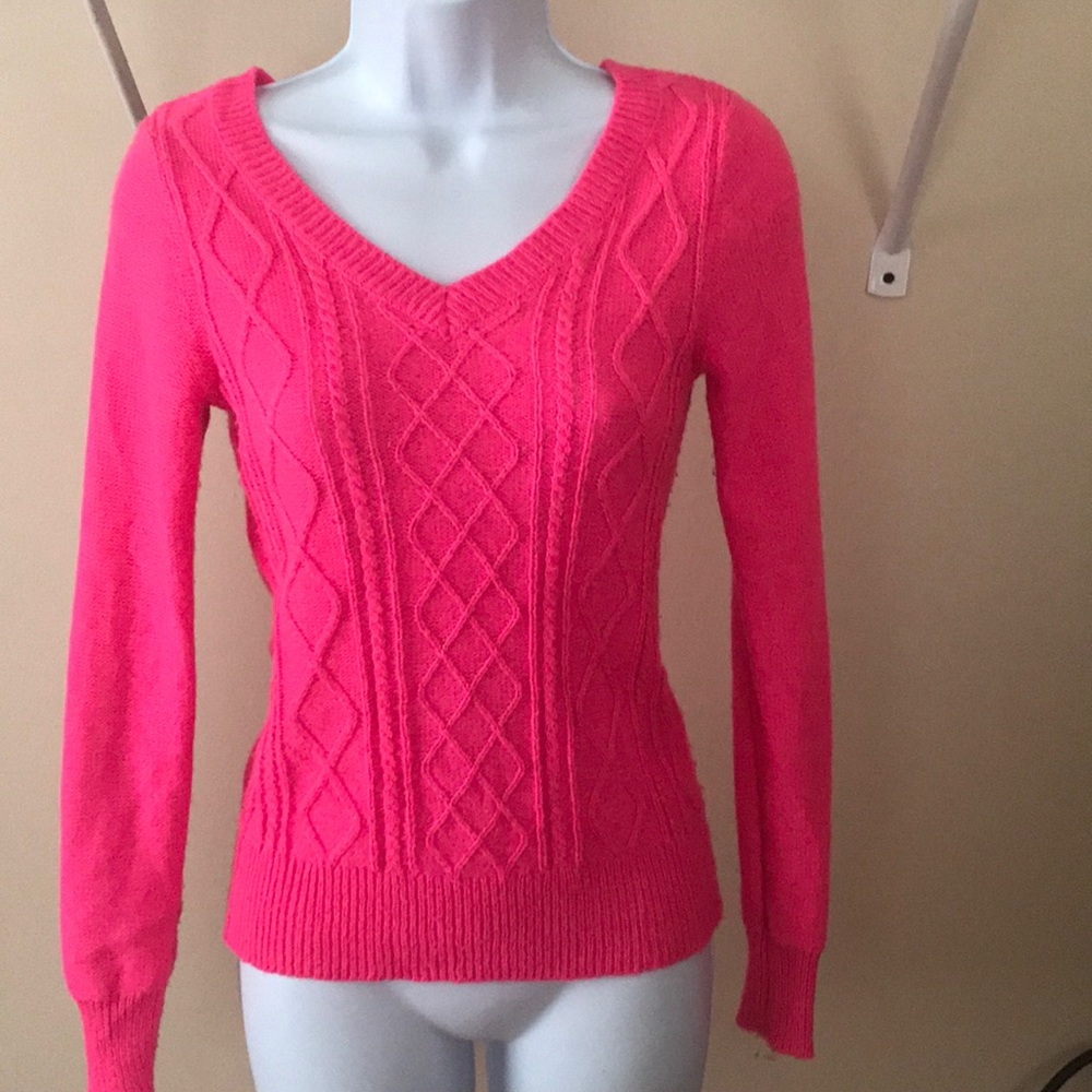 V-neck cable knit sweater.